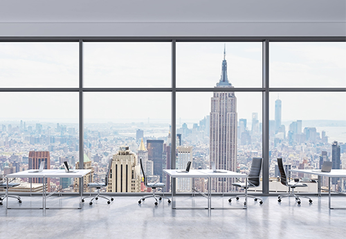 image of an empty office space with a view of the empire state building and the manhattan skyline